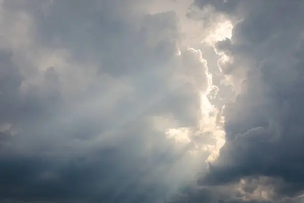 Photo of Sunbeam between storm clouds cloudscape sky