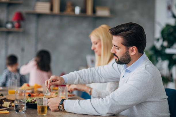 istock Two happy young parents having lunch 1205245594