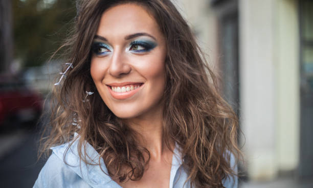 Young woman with professionally done make-up.