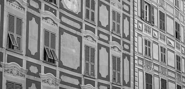 Characteristic facade of an ancient house of Camogli, a small fisherman village on the shores of the Ligurian Sea. (Northern Italy); during summertime became full of tourists, coming from all Italy and abroad, attracted by the clear sea waters and good food.
