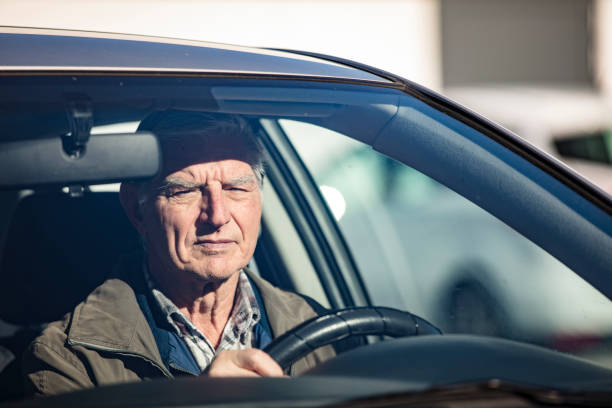 istock Active Senior Man Driving a Car - Stock Photo 1205247524