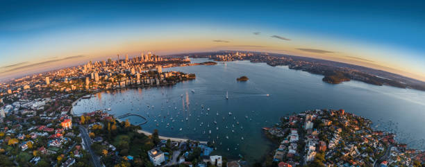 Sydney Harbour sunrise aerial photo with curvature Sydney Harbour sunrise aerial photo with curvature fish eye lens photos stock pictures, royalty-free photos & images