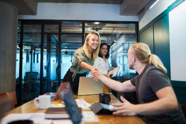 istock Business meeting hand shake in the board room. 1205248126