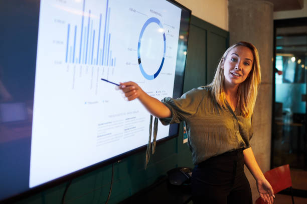 istock One young businesswoman making a presentation speech. 1205248129