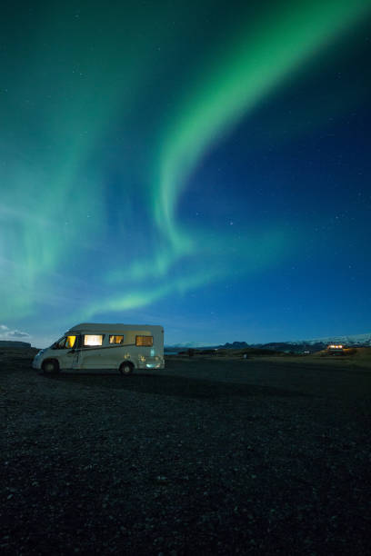 istock Northern Lights above an Icelandic beach and a caravan 1205248173