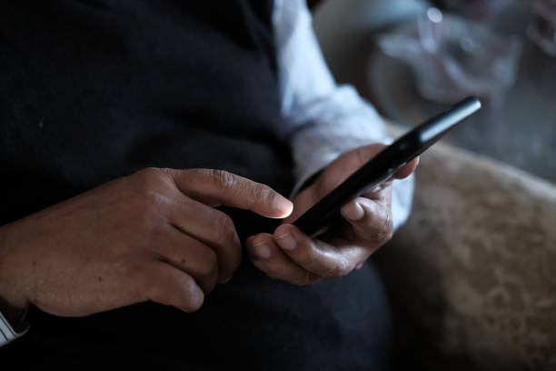istock senior man hand use smart phone 1205248829