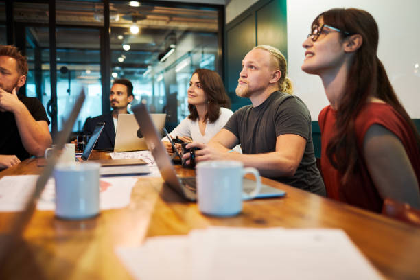 istock Business partners listening to the presentation. 1205249227