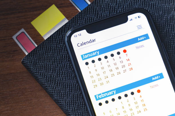 Calendar on your mobile phone, top view Calendar on your mobile phone, top view phone calendar stock pictures, royalty-free photos & images