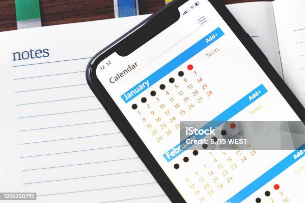 Calendar On Your Mobile Phone And Notebook Stock Photo - Download Image Now - Calendar, Mobile Phone, Device Screen