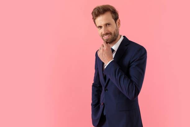 istock Charming businessman holding his hand on his chin and smiling 1205251414