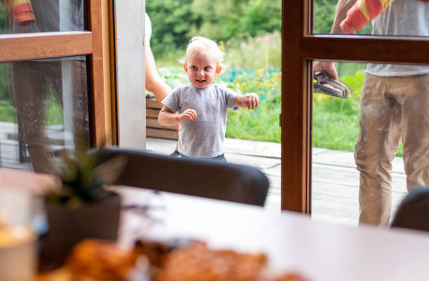 istock Excited little child boy arrived home with parents 1205251995