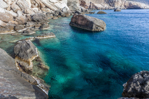 istock Greek coast with blue sea and cliff 1205252667