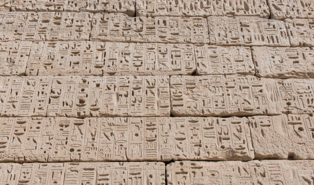 istock Hieroglyphic carvings on an ancient egyptian temple wall 1205252814