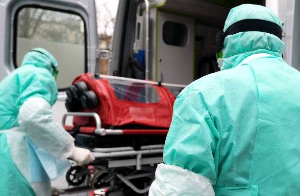 istock biohazard, virus, face in protective suit and gas mask 1205255251