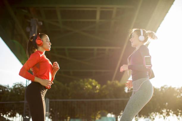 istock Two fitness women doing  exercise before running outdoor 1205255347