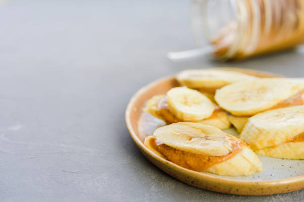 istock Banana with peanut butter 1205257076