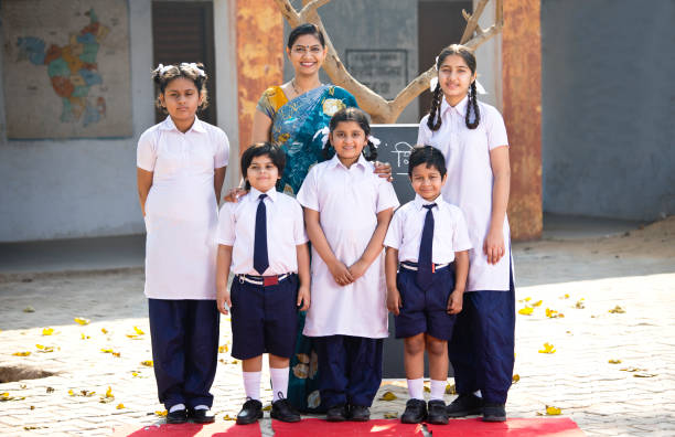 istock Teacher and kids at school campus 1205257269