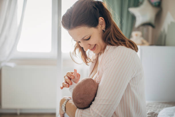 istock Mother breastfeeding her baby boy at home 1205257374