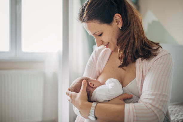 istock Mother breastfeeding her baby boy at home 1205257464