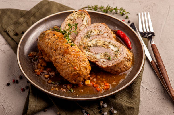 istock Baked meat rolls in a thick vegetable sauce. 1205257498