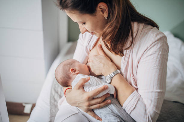 istock Mother breastfeeding her baby boy at home 1205257512