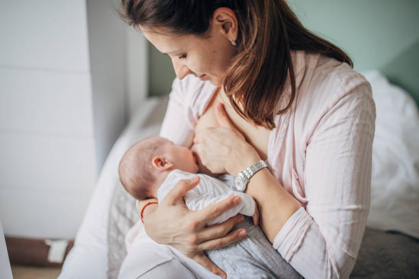 istock Mother breastfeeding her baby boy at home 1205257567