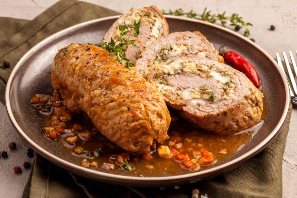 istock Baked meat rolls in a thick vegetable sauce. 1205257571