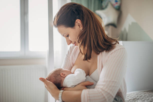 istock Mother breastfeeding her baby boy at home 1205257723