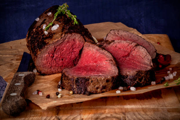 istock Roast beef from tenderloin A large piece is cut into pieces. 1205258181