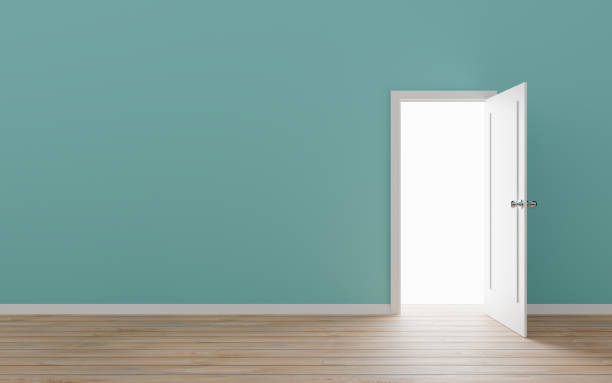 Opened door with blue wall stock photo