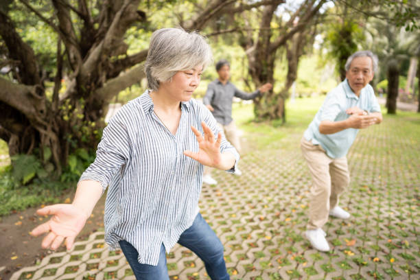istock Instructor of tai chi shows how to do it 1205259457