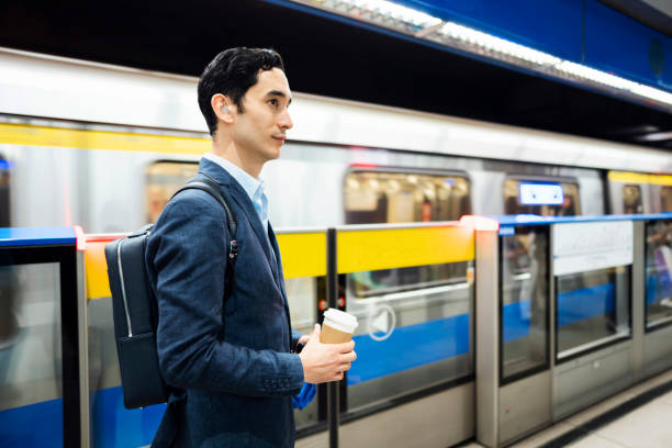 istock Subway train is his way to get to the office fast 1205260078