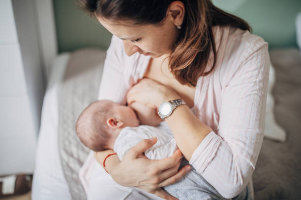 istock Mother breastfeeding her baby boy at home 1205260330
