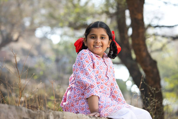 Girl  in the summer garden on a picnic.