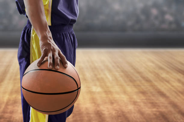 istock Basketball player holding a ball 1205260753