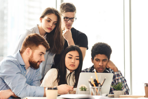 istock College friends studying together at library, copy space 1205262500