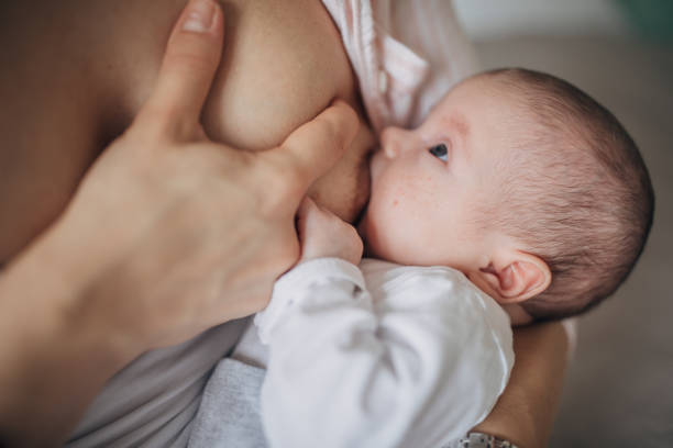istock Mother breastfeeding her baby boy at home 1205263634