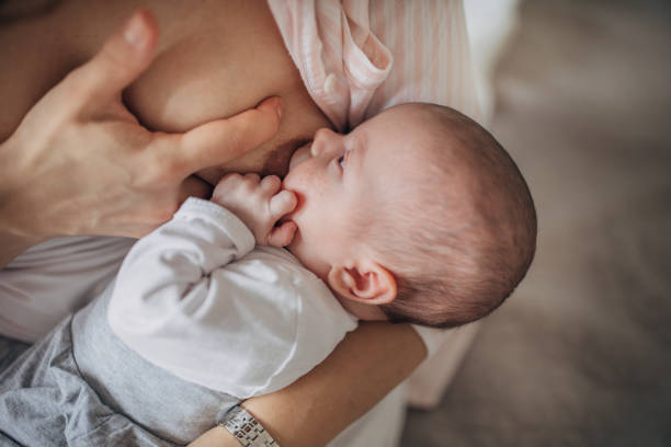 istock Mother breastfeeding her baby boy at home 1205263679