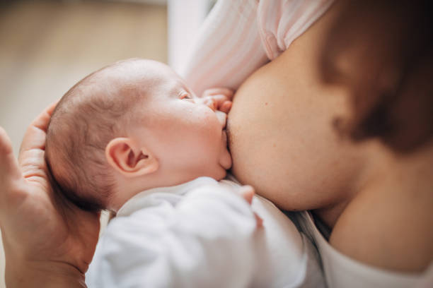 istock Mother breastfeeding her baby boy at home 1205264205