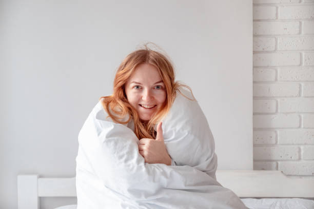 istock Woman woke up in bed 1205264364