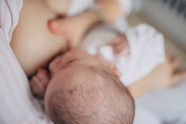 istock Mother breastfeeding her baby boy at home 1205264879