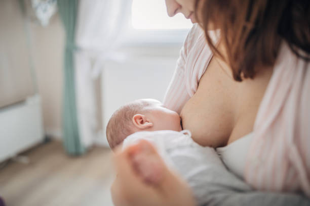 istock Mother breastfeeding her baby boy at home 1205264924