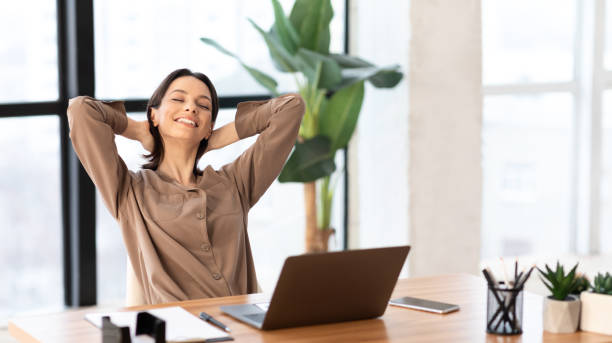 istock Happy european girl stretching hands at workspace 1205266787
