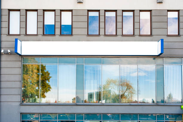 istock Blank white advertising banner on the wall of office building 1205267332