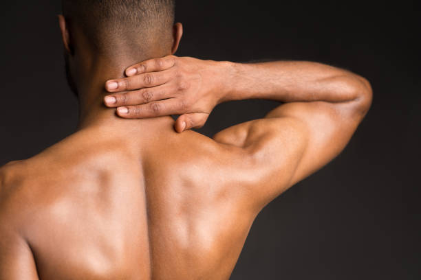 masseur girl makes a massage close-up on a dark background. close-up massage
