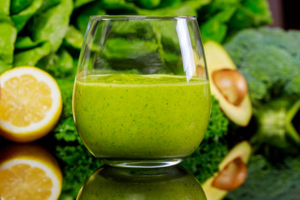 istock Green healty smoothie with broccoli, lemon and avocado in blurry focus. 1205271448