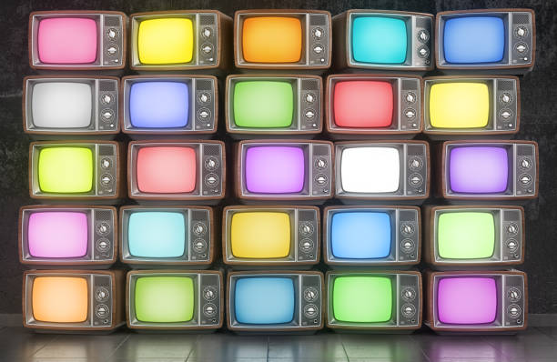 istock Wall of old TVs with different colors screen. 3d illustration 1205271718