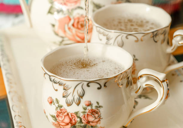 pouring green tea into a chine cups