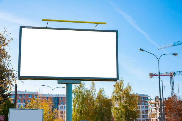 istock Blank white billboard for advertisement in the front of construction site 1205272137