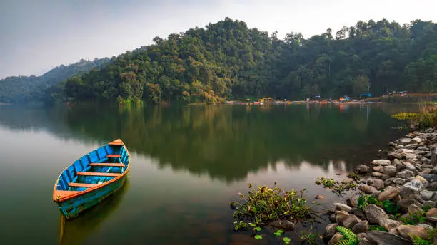 Photo of A single Beautiful Boat parked in Begnas Lake Nepal